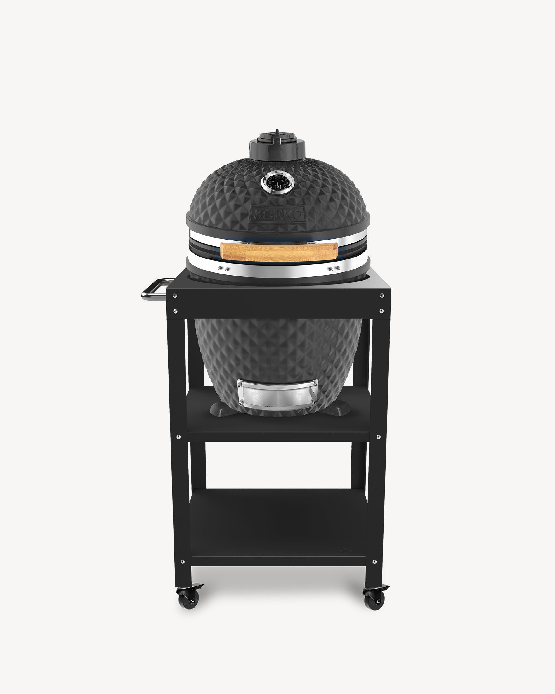 Barbecue kamado Kokko L 18 pouces coloris noir, installé sur desserte avec rangements et roulettes