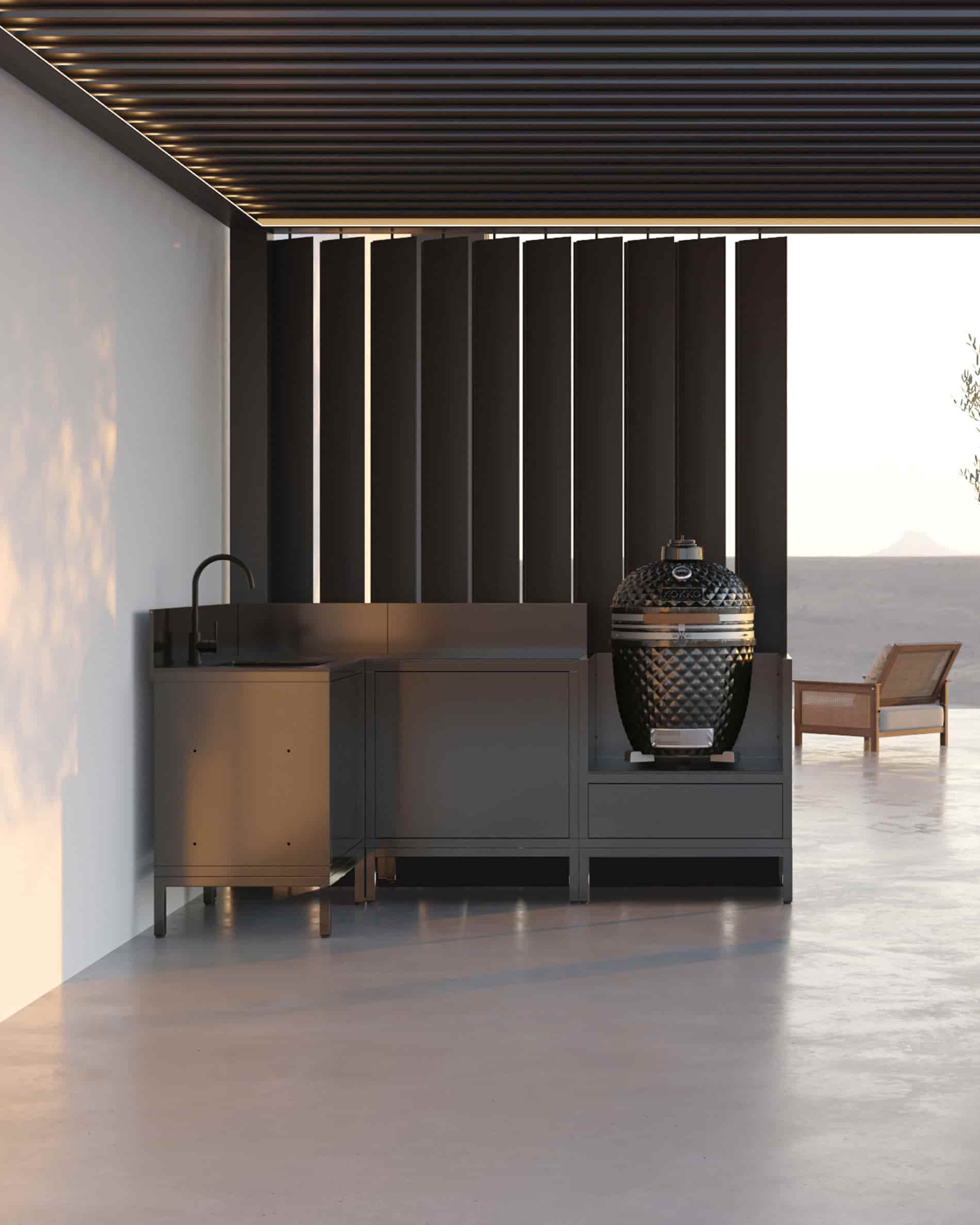 Cuisine pilotis avec kamado, configuration d’angle noire sous pergola, meubles fermés et plan de travail avec évier.